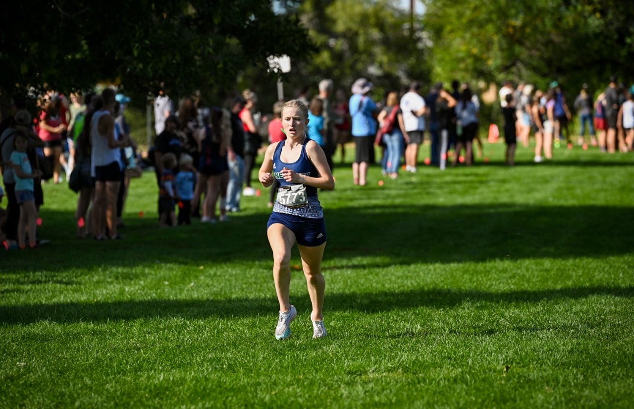 Girl running in grass